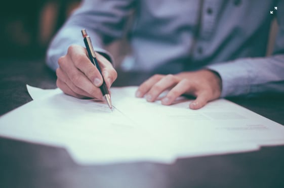 man filling out grant application 